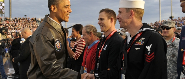 111111-N-OK922-986 SAN DIEGO (Nov. 11, 2011) President Barak Obama greets Electronic's Technician 3rd Class Donald Brazeal before the tip-off of the inaugural Quicken Loans Carrier Classic aboard the Nimitz-class aircraft carrier USS Carl Vinson (CVN 70). Carl Vinson is hosting Michigan State University and the University of North Carolina for an NCAA basketball game. (U.S. Navy photo by Mass Communication Specialist 3rd Class Roza Arzola/Released)